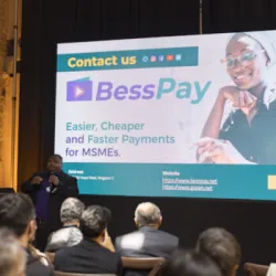 Douglas Davidson, co-founder of BessPay, presenting in front of a screen displaying the text: ‘BessPay – Easier, Cheaper and Faster Payments for MSMEs.’